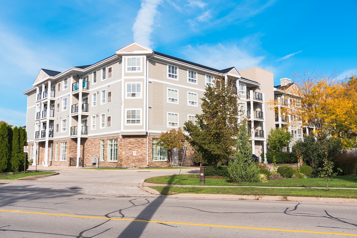 Modern apartment building along a street on a clear autumn morning Modern apartment building along a street on a clear autumn morning